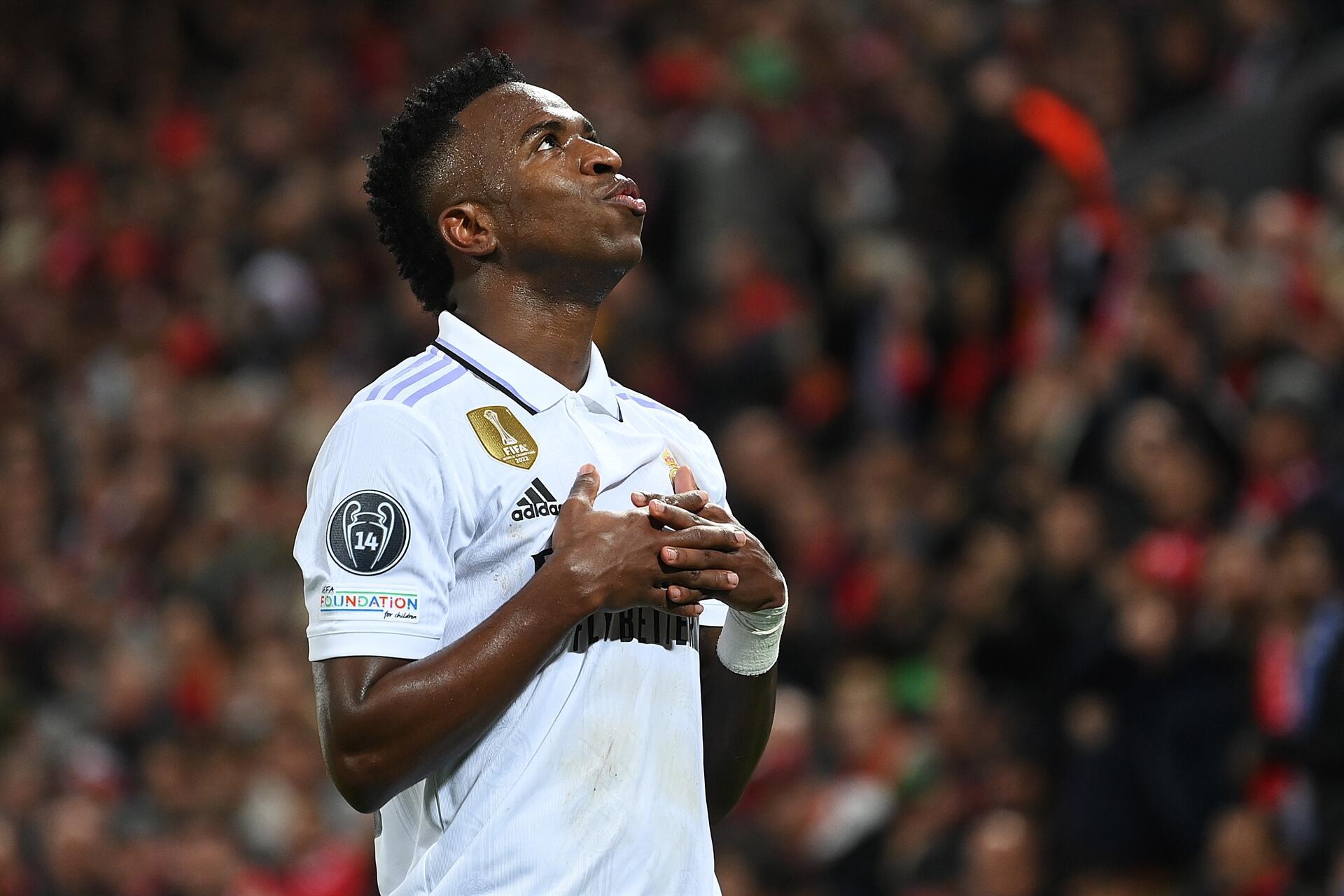 LIVERPOOL, ENGLAND - FEBRUARY 21: Vinicius Junior of Real Madrid celebrates after scoring the teams second goal during the UEFA Champions League round of 16 leg one match between Liverpool FC and Real Madrid at Anfield on February 21, 2023 in Liverpool, England. (Photo by Michael Regan/Getty Images)